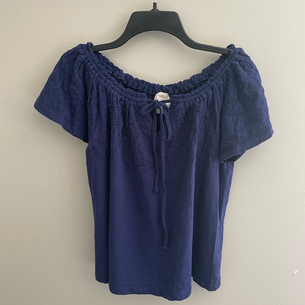 BRAND NEW! Blue summer top with flower detailing on the sleeves!